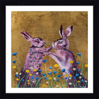 A framed and mounted print featuring two stylized hares boxing, set against a golden background with colorful flowers at the bottom.